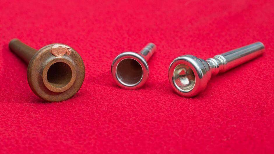 The 'spear-butt' shown alongside modern instrument mouthpieces