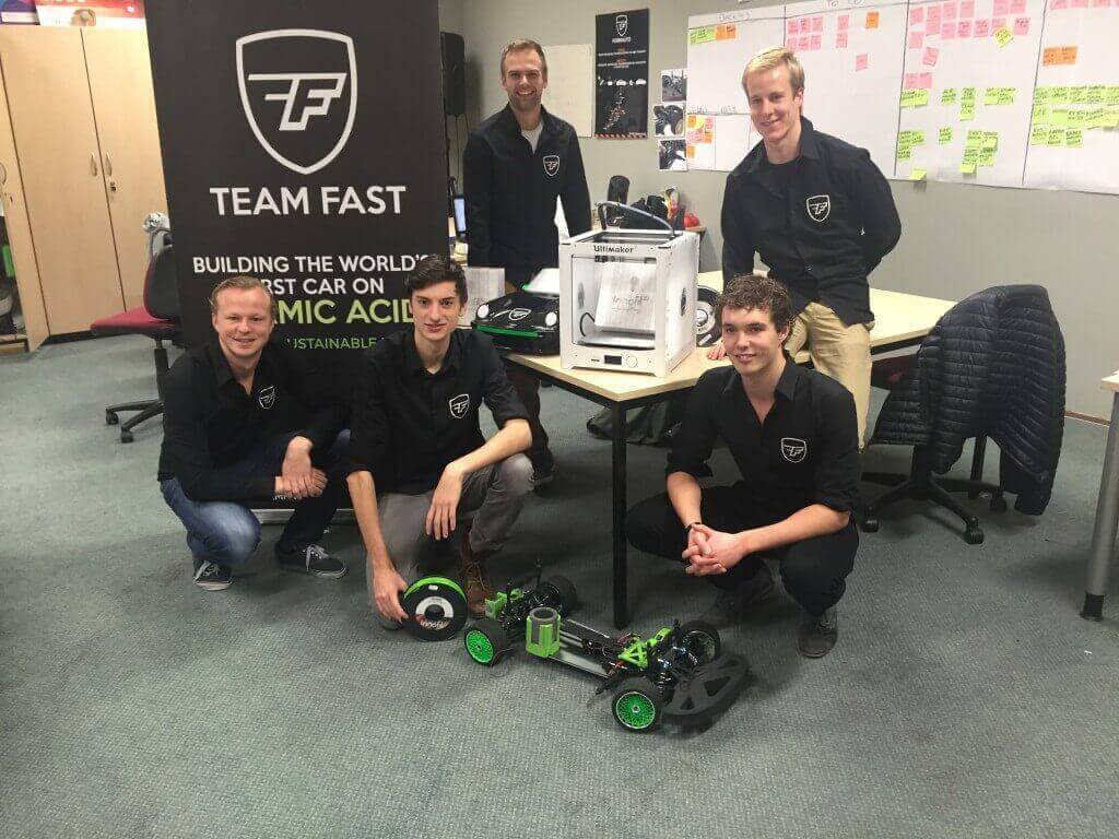Team FAST with a model of their sustainable car.