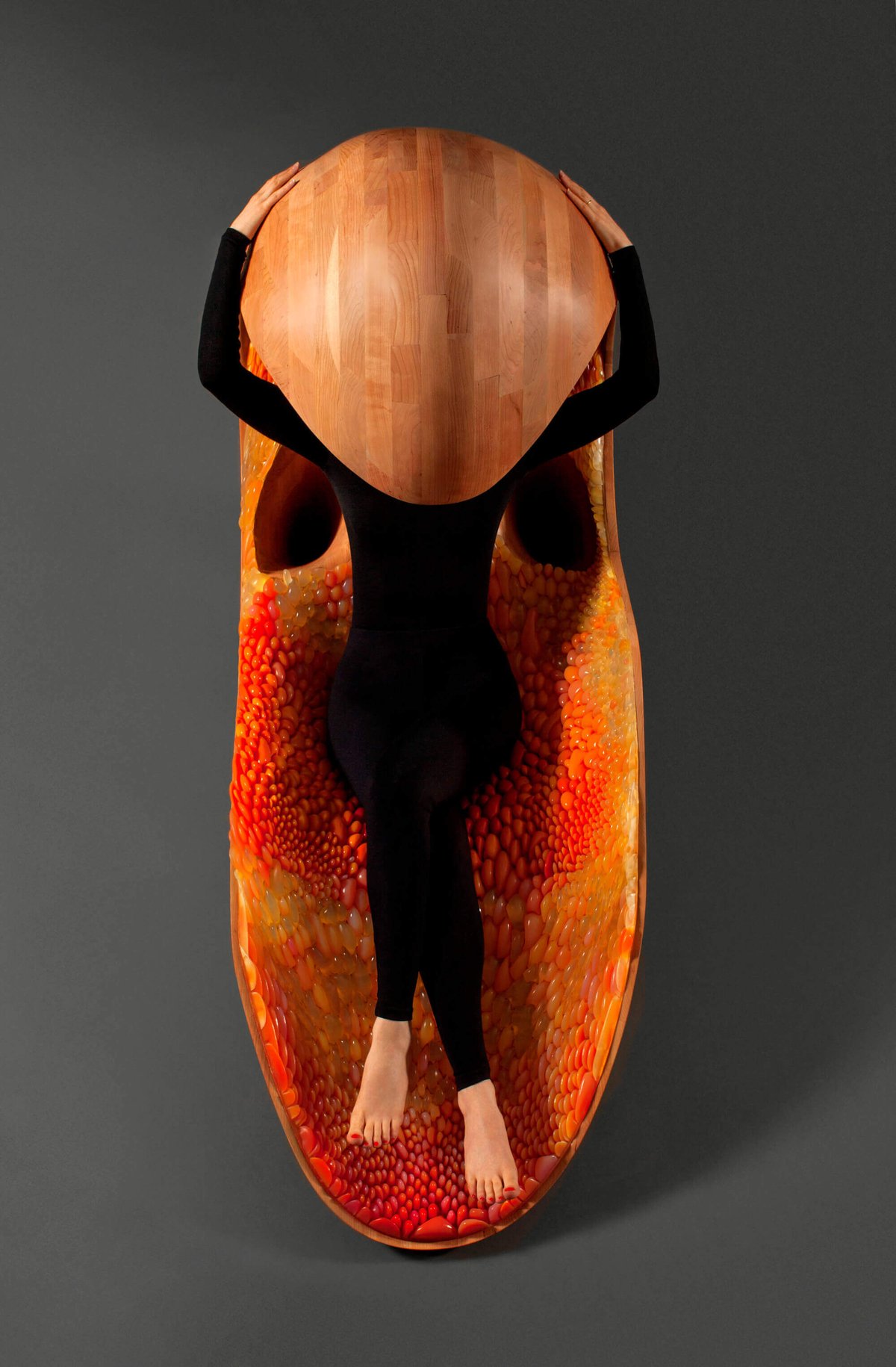 Neri Oxman laying in her Gemini Chair
