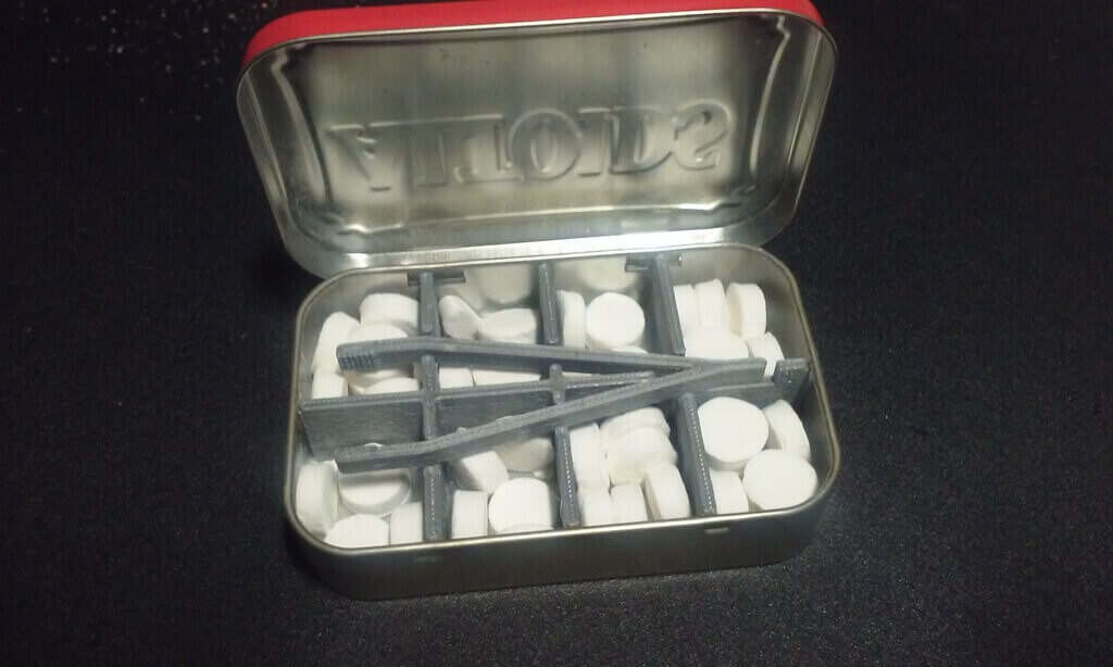 tin divider with tweezers