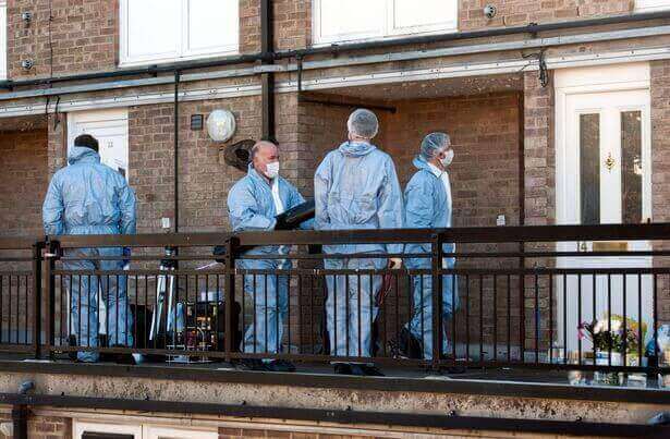 Forensic police officers outside the family home in Sutton where Ellie was found fatally injured