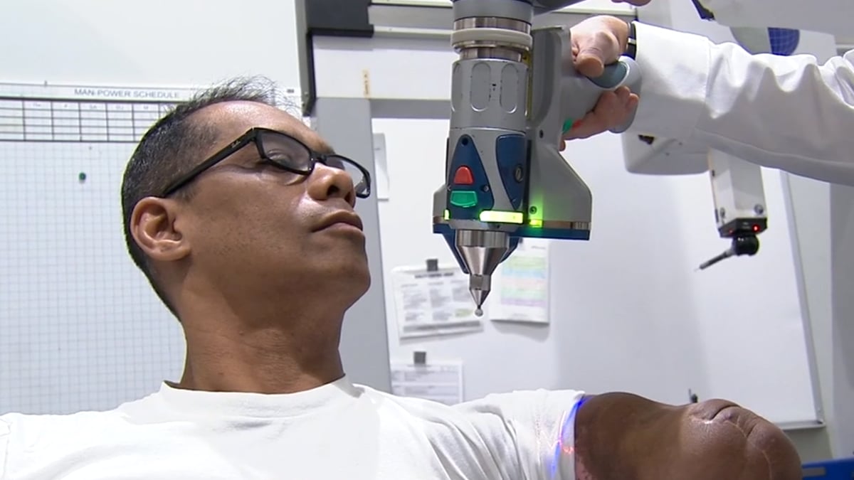 Honda employees scan Tony's arm