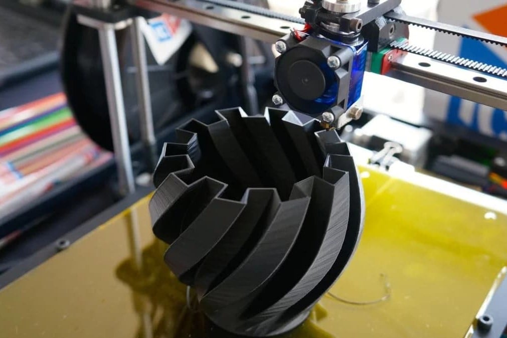 A vase being printed on an FDM machine. 