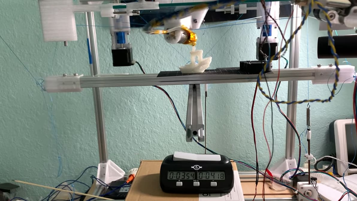 Featured image of This Super-Speedy ‘Marionette’ 3D Printer Uses String-Based Kinematics