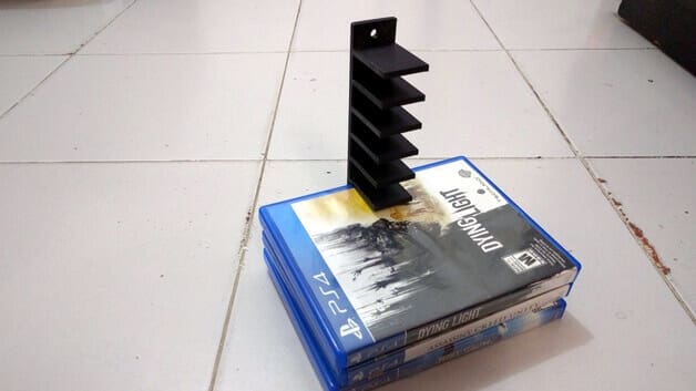 Image of Best PS4 Mods and Accessories to 3D Print: PlayStation 4 - Blu Ray Wall Rack/Hanger