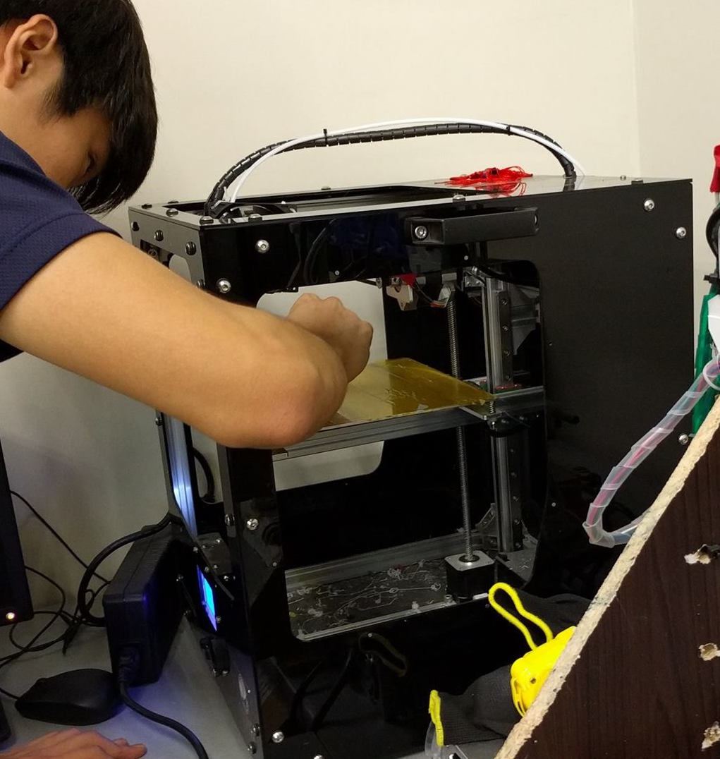 The old 3D printer being repaired (as usual)