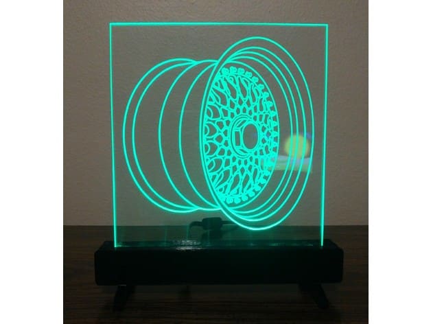 An assembled acrylic sign with 3D printed base.