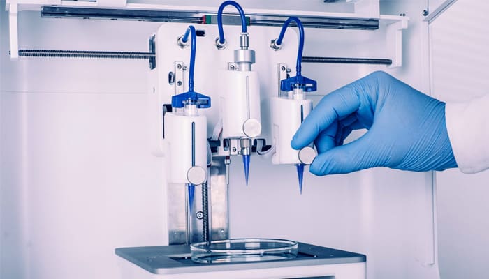 A 3D bioprinter with three extruders.