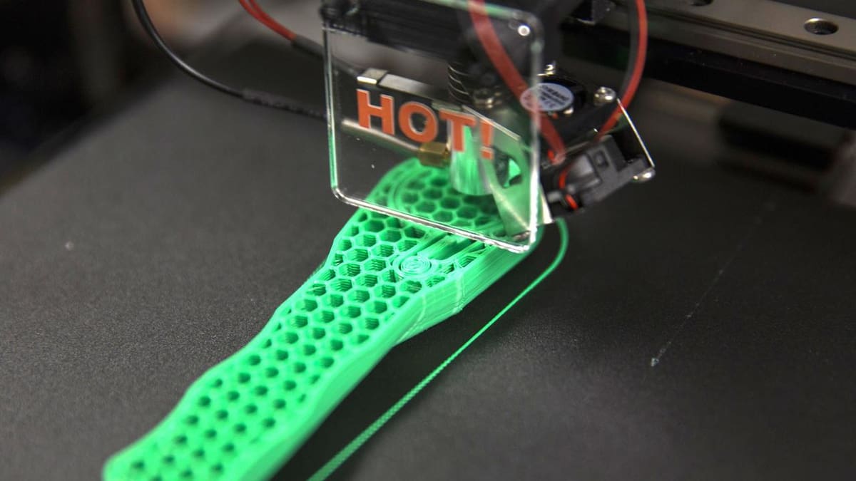 Marines from various units manufacture a ratchet using a 3D printer at Marine Corps Base Camp Lejeune.
