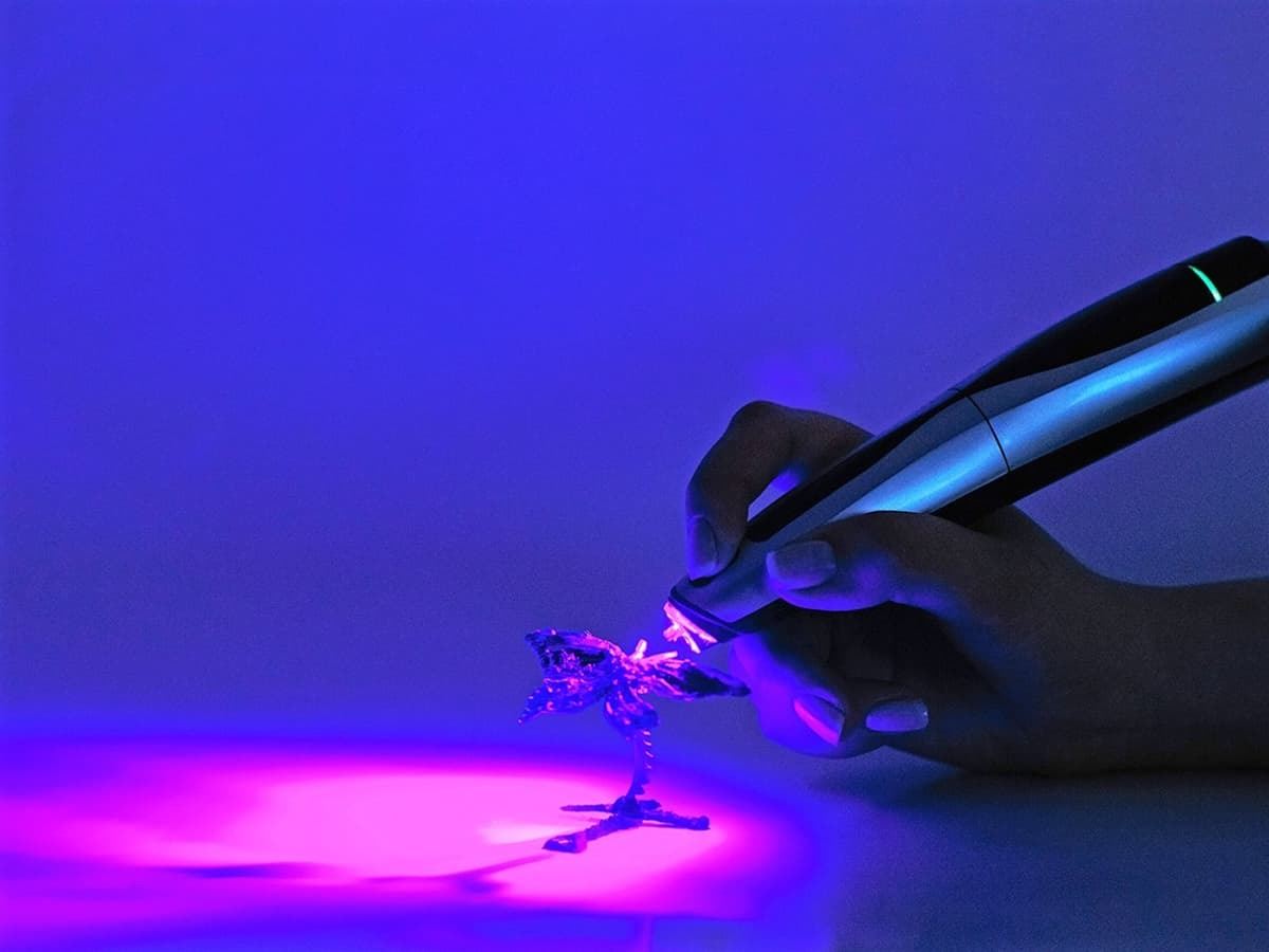 CreoPop's Cool Ink is hardened with a UV light source.