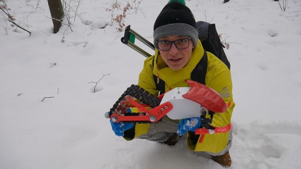 Nikodem Holding the Snowmobile