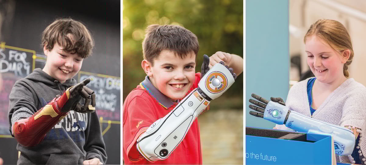 Bionic Heroes showing off their Disney-themed 3D printed arms.