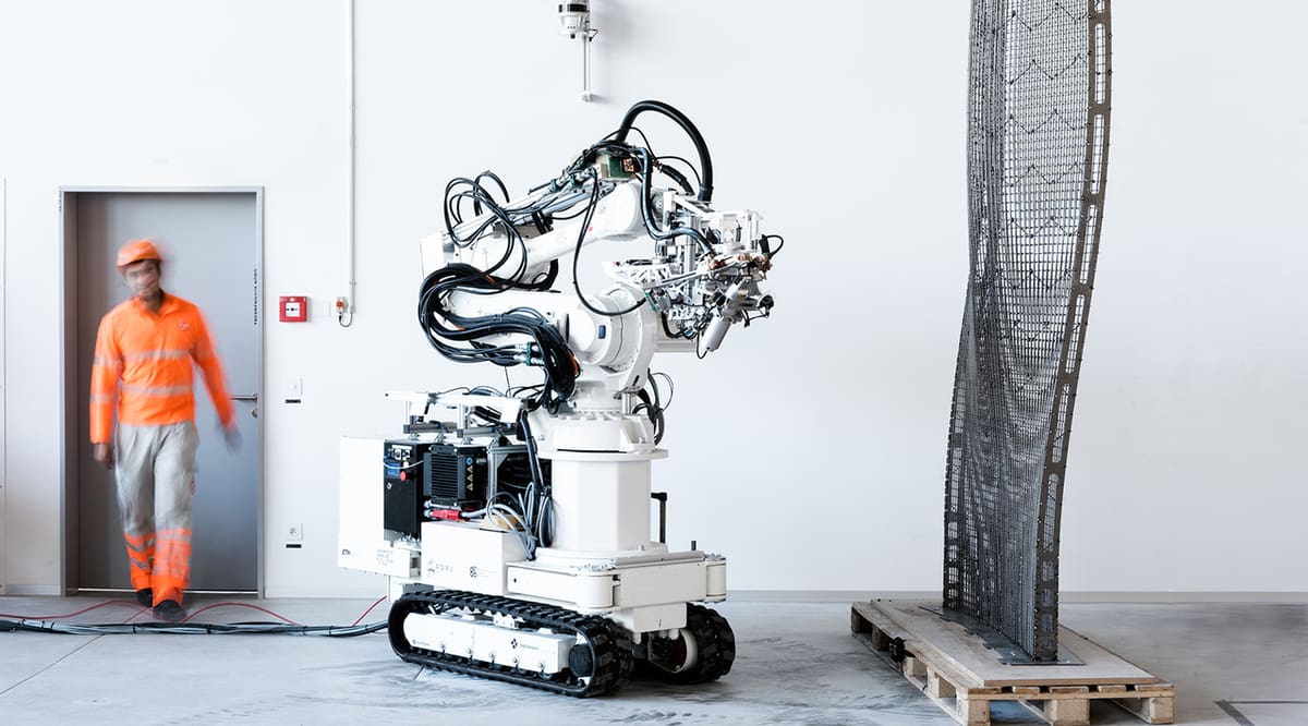 A large robot building a house.