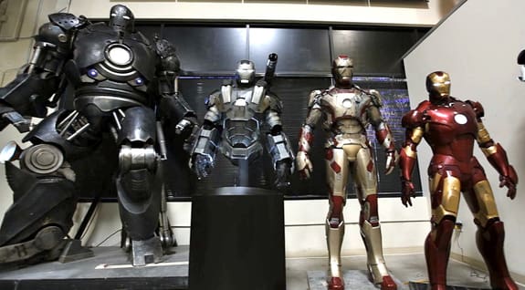 3D printed Iron Man suits on display.