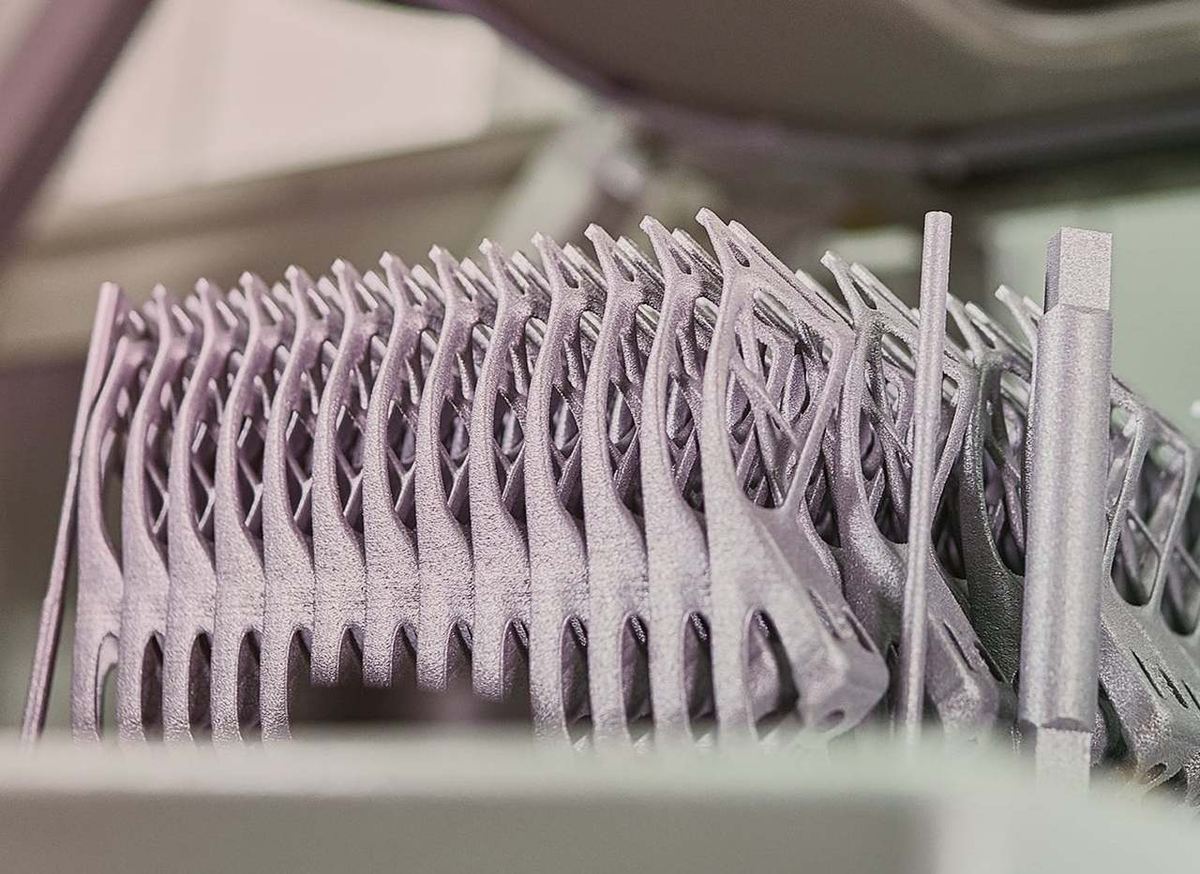 A bunch of metal 3D printed parts for the BMW i8 Roadster during fresh out of the 3D printer.