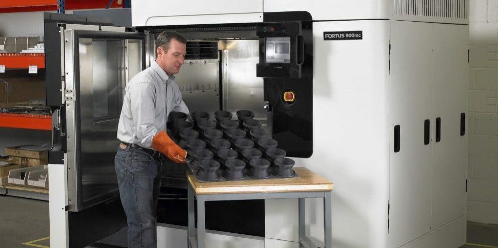 Industrial grade Stratasys 3D printer in use.