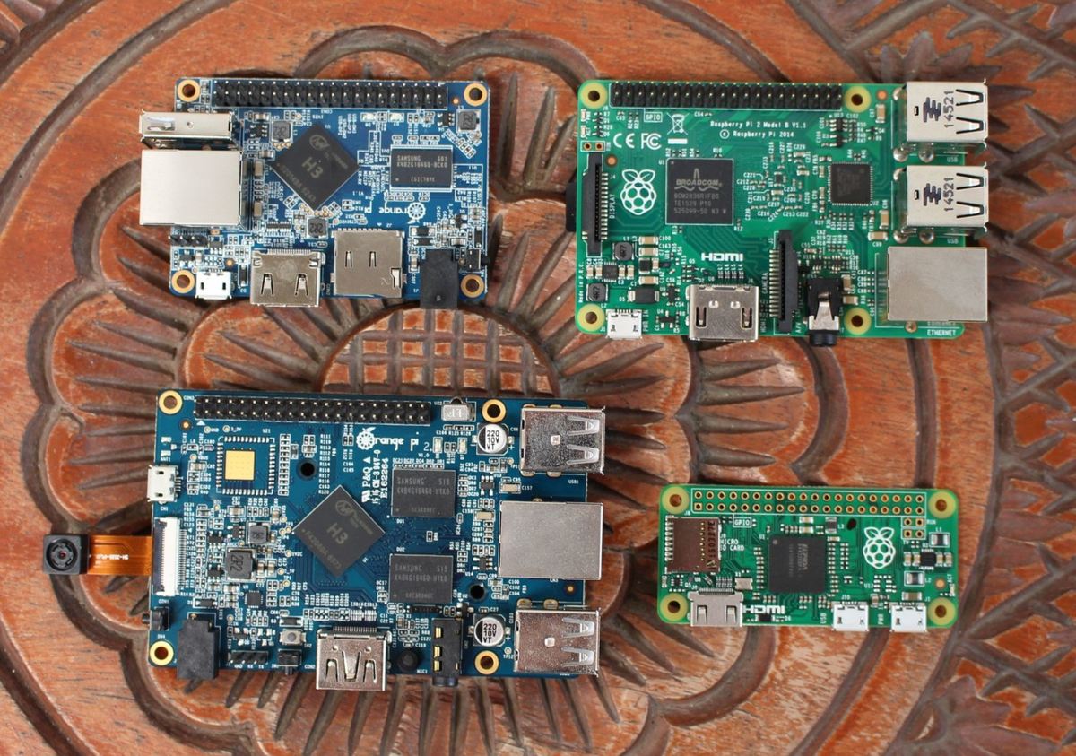A couple Raspberry Pis fight off a pair of Orange Pis.