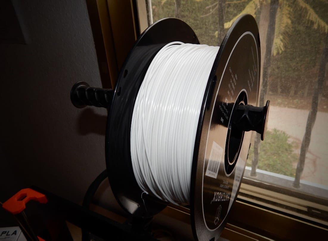 Our spool of PLA sitting atop the Prusa.