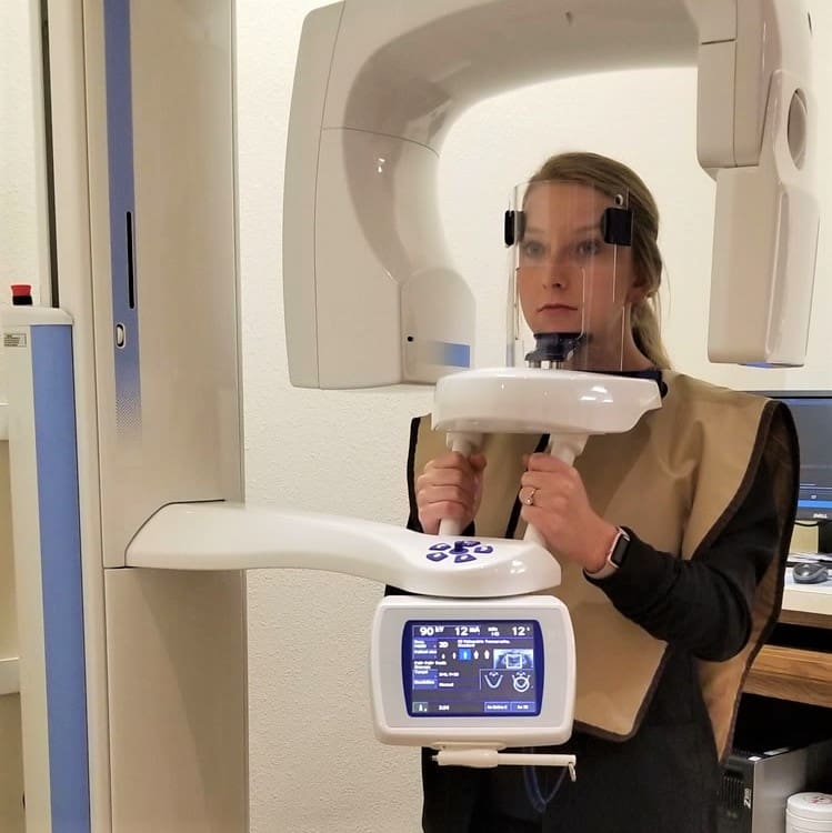 A dental CBCT scanner in operation.