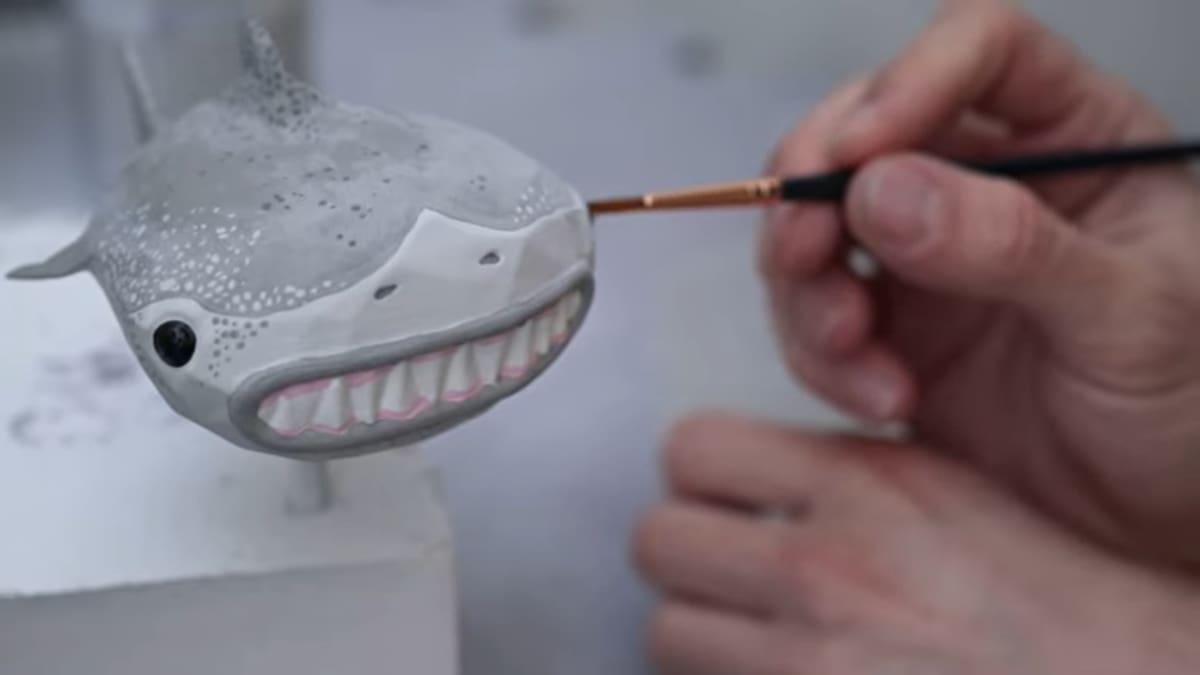 Using acrylic paint and a paintbrush