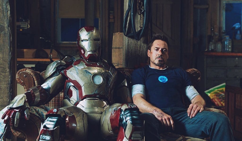 The MK42 suit next to Iron Man actor Tony Stark.