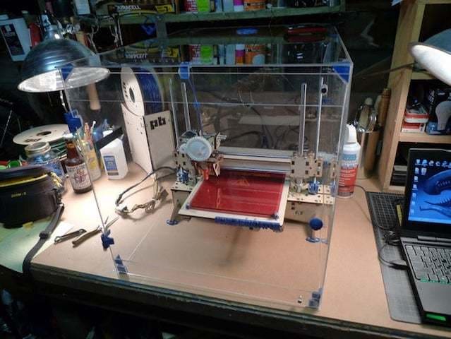 A plexiglass enclosure intended to keep ambient temperatures toasty for PC printing success.
