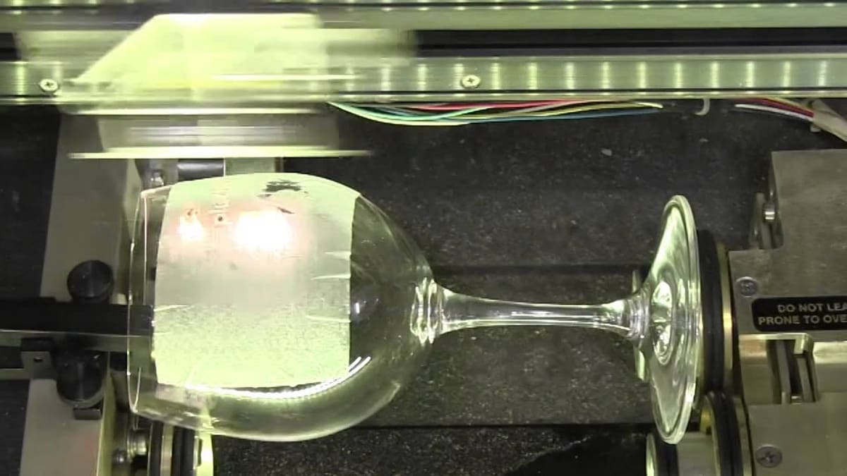 Laser engraving a wine glass.