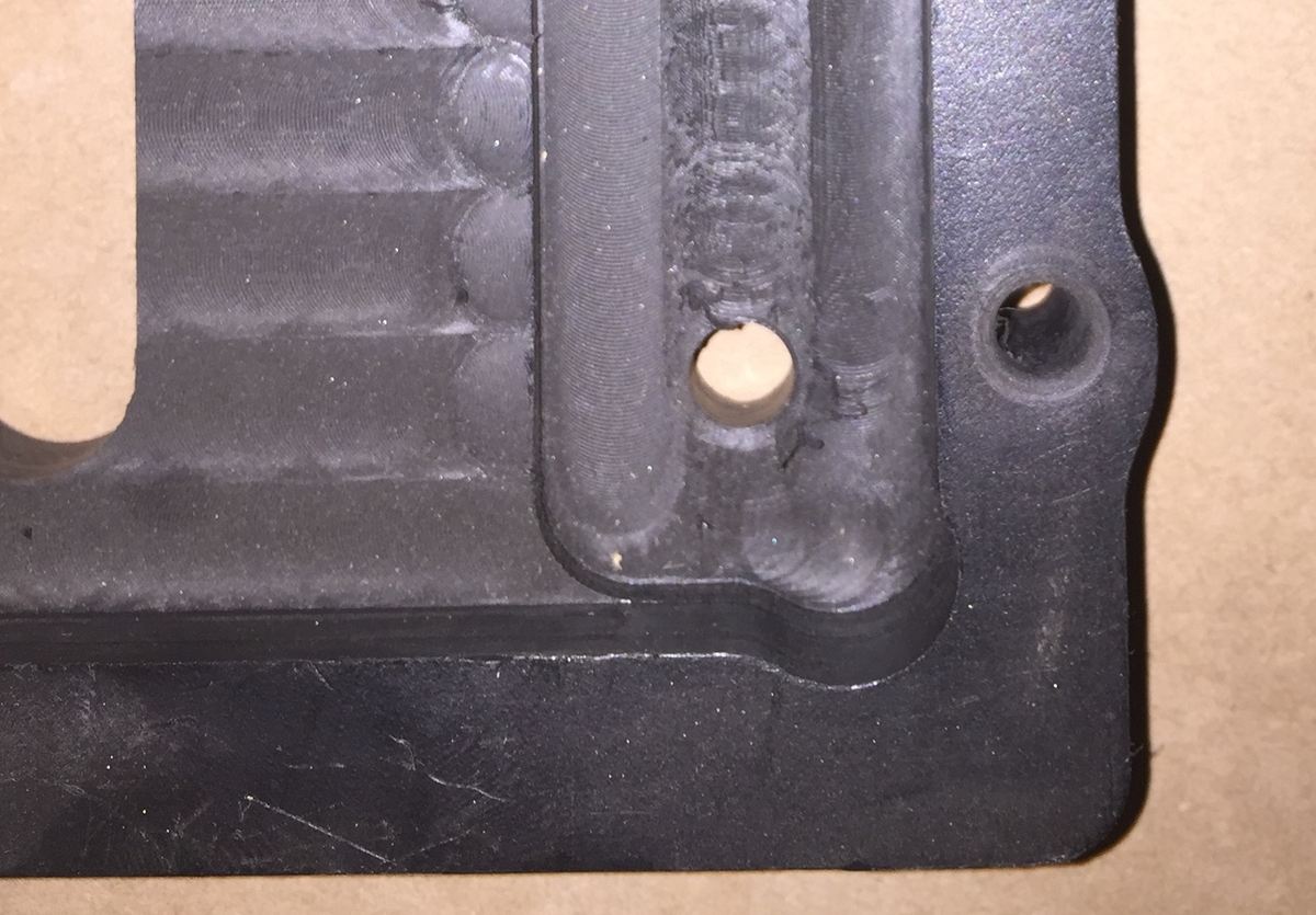 A machined tray with dog bone corners.