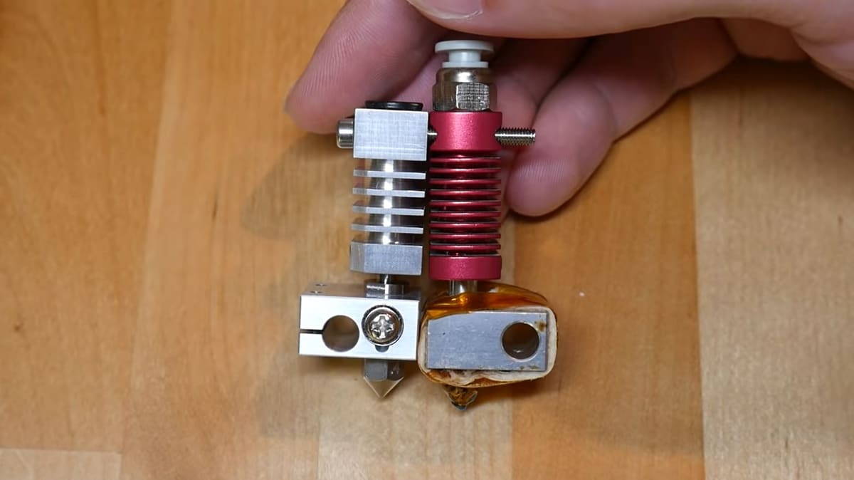 On the left, we have the old (silver) and on the right (red) hot ends