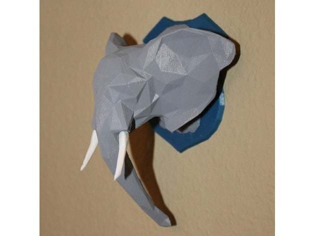Painted low-poly elephant trophy.