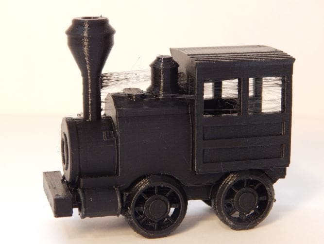 The toy train model with good details but lots of strings.