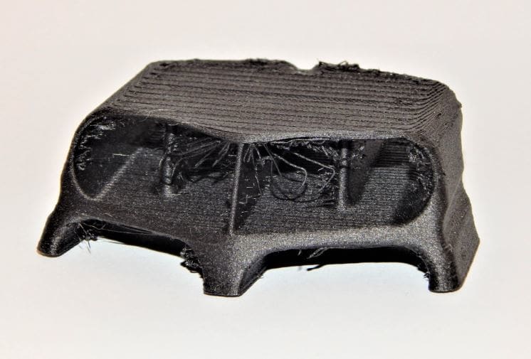 HEre we can see some of the failed bridging on the rear of our hood scoop.