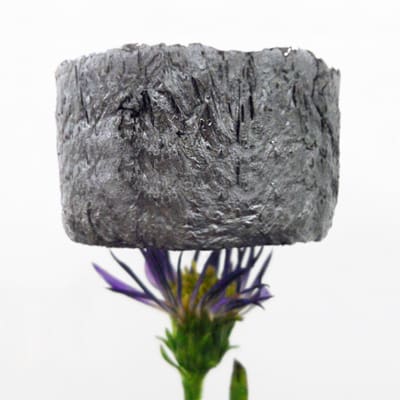 This graphene aerogel block doesn't even disturb its flower support.