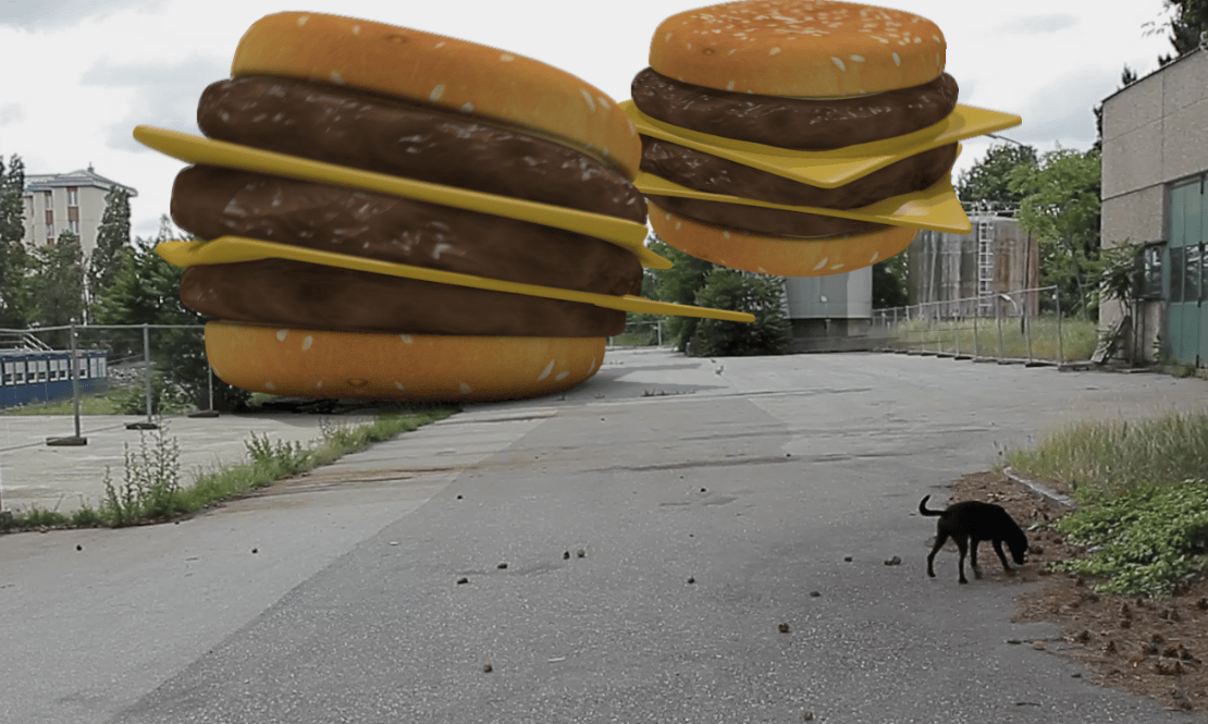 Some giant 3D burgers on a street