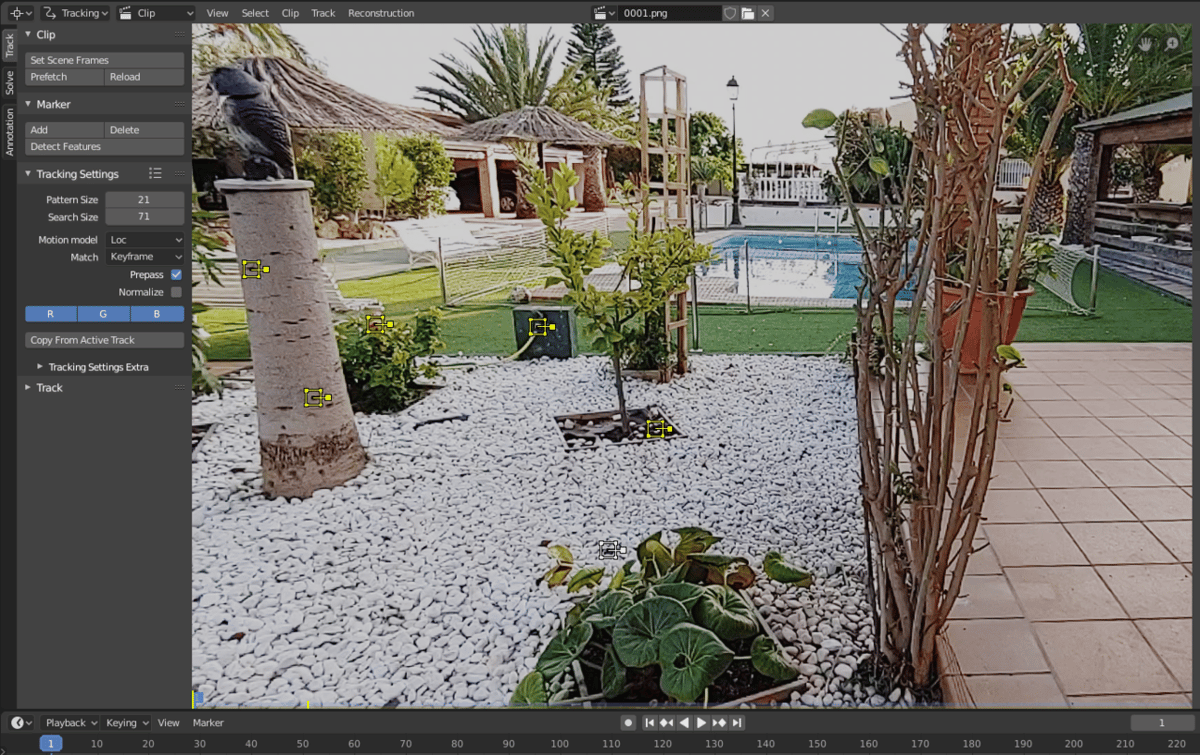 A video frame with yellow tracking markers in Blender
