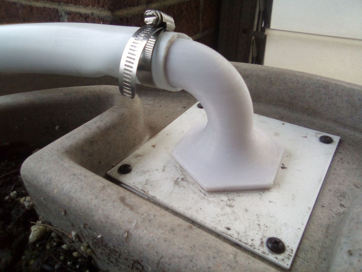 A custom downspout-to-rain-barrel connector