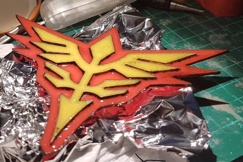 This dual-extruded Neo Zeon logo was made on a FlashForge Creator Pro 3D printer