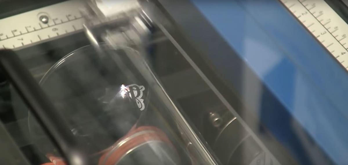 Laser engraving a cup on an Epilog laser