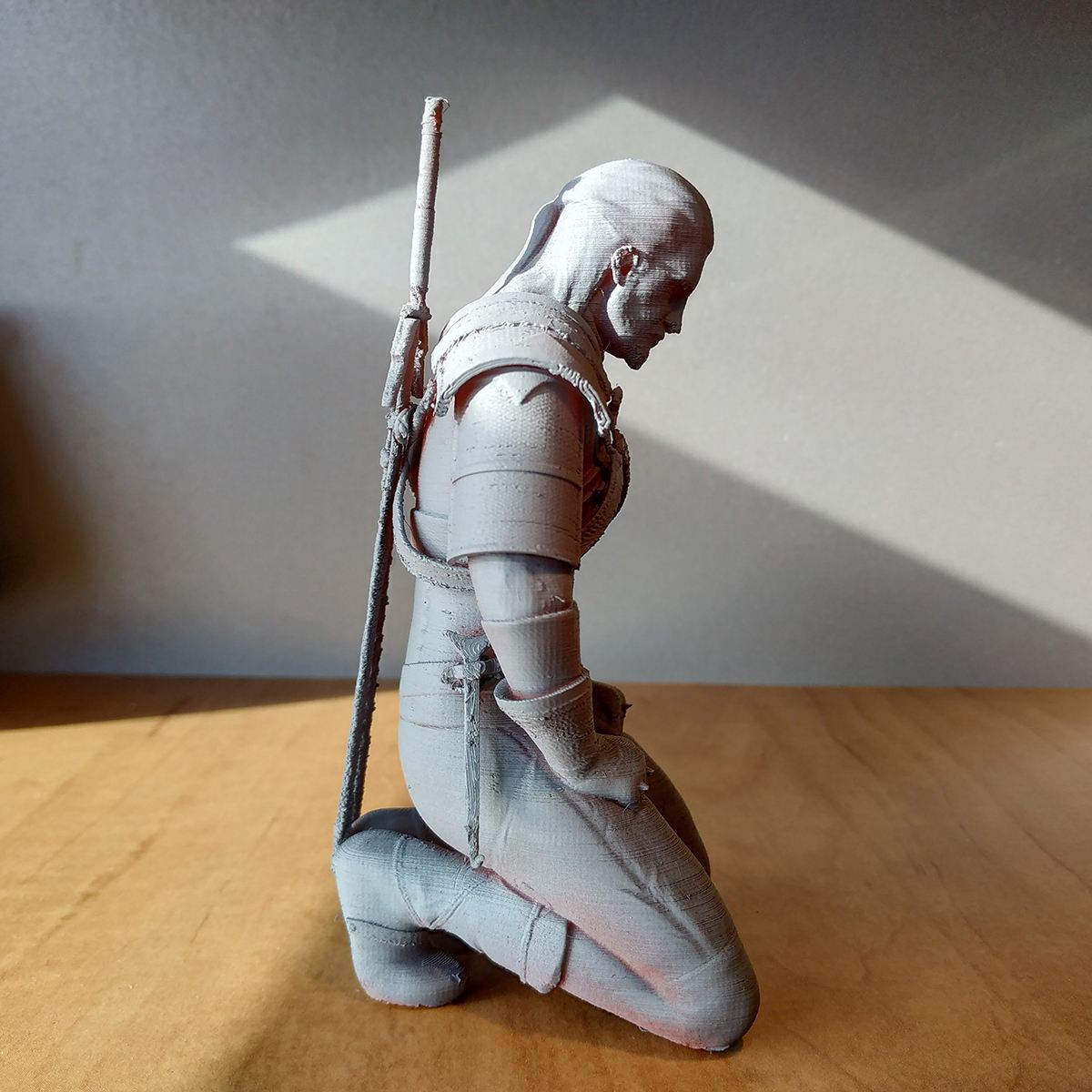 Geralt kneeling to meditate