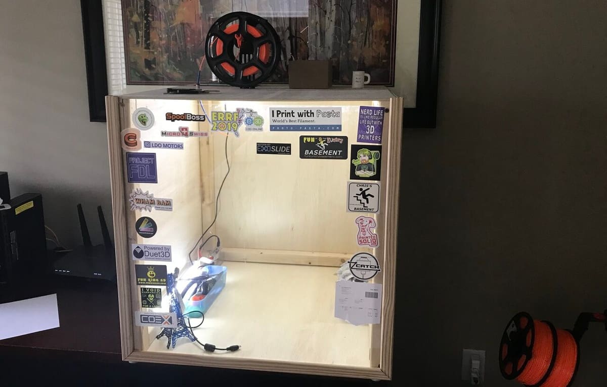 A wood enclosure is cheaper than all plexiglass