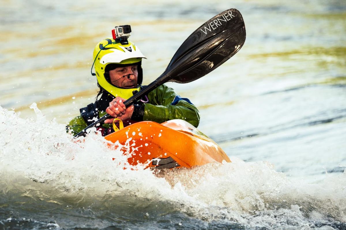 A kayaker fighting the waves
