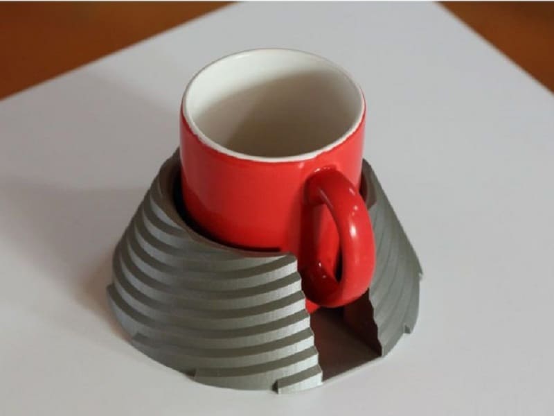This tip resistant cup holder has a unique and utilitarian design
