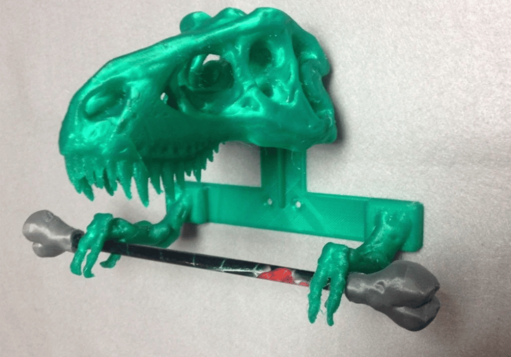 The toilet paper holder from the T-Rex bathroom set