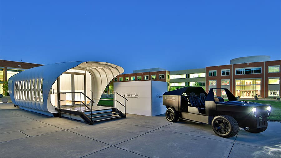 AMIE is the integration of a solar-powered house with a hybrid electric vehicle, both 3D printed