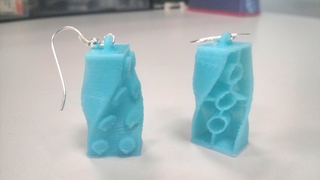 The twisted bricks show both sides of a Lego-like brick