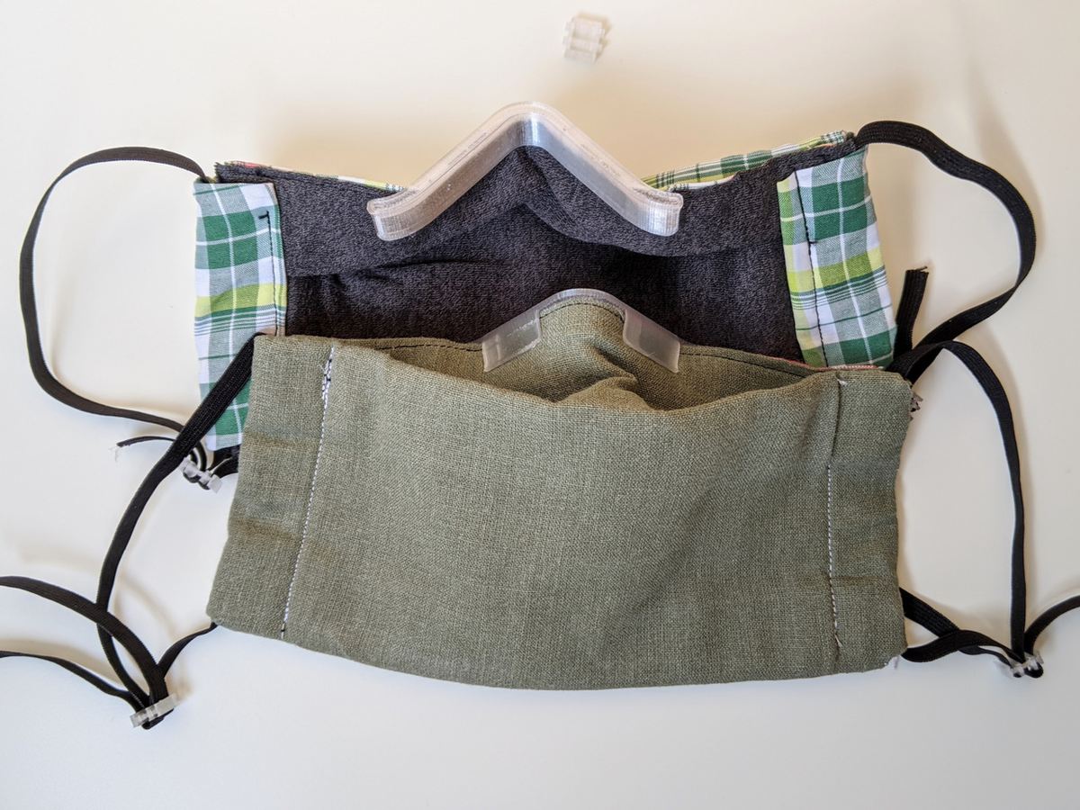 A clip-on nose bracket for cloth masks can provide a better fit