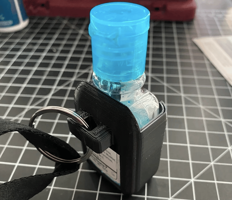 Clip your hand sanitizer to whatever you want with this handy print