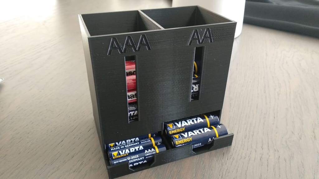 This handy dispenser holds both AA batteries and AAA batteries