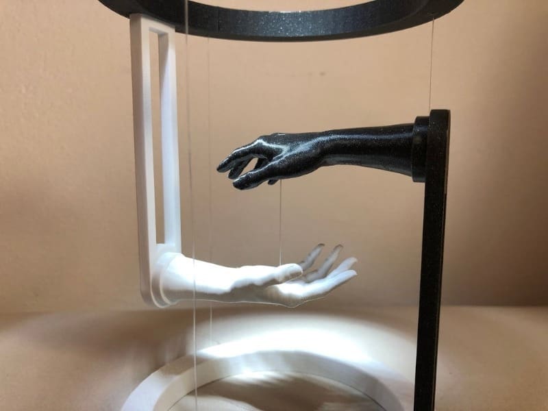 This illusion gives the sense that the hands attract one another