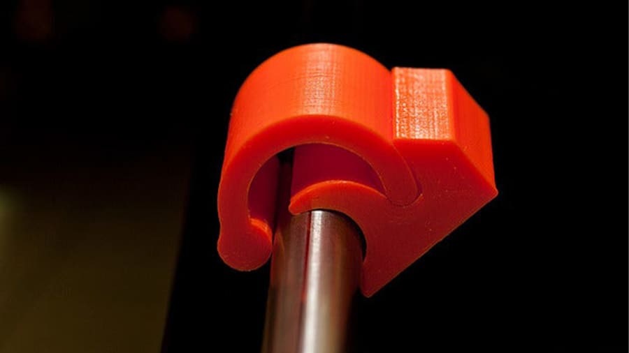 The rod clasp is a great snap-action mechanism for the rods usually found on desktop 3D printers